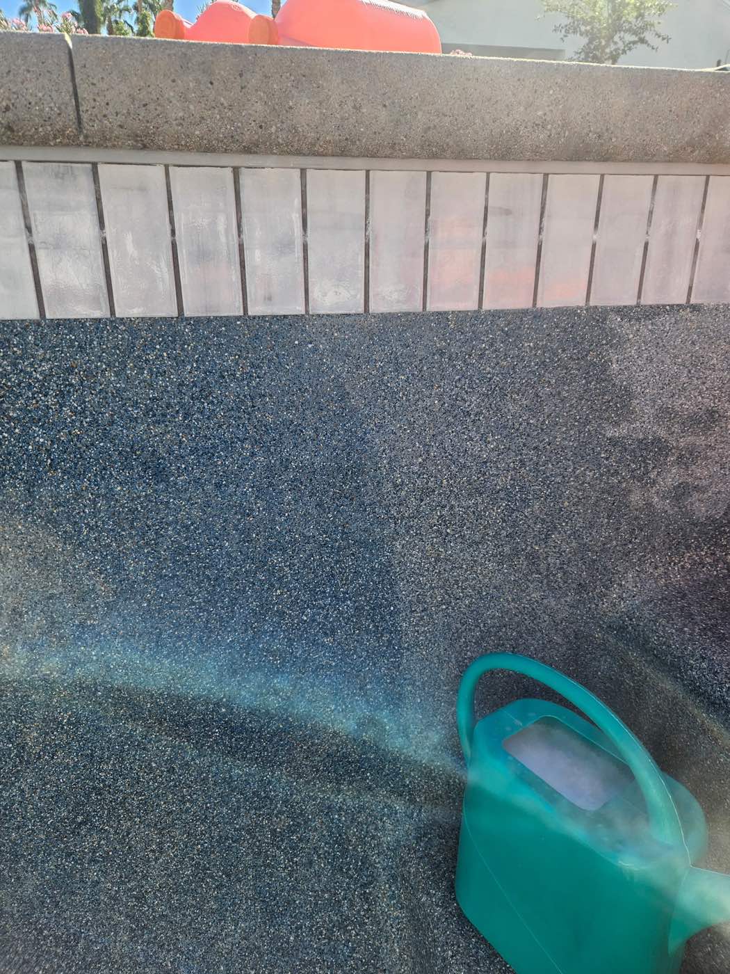 Pool surface split view: cleaned surface after an acid wash on the left, stained surface before on the right